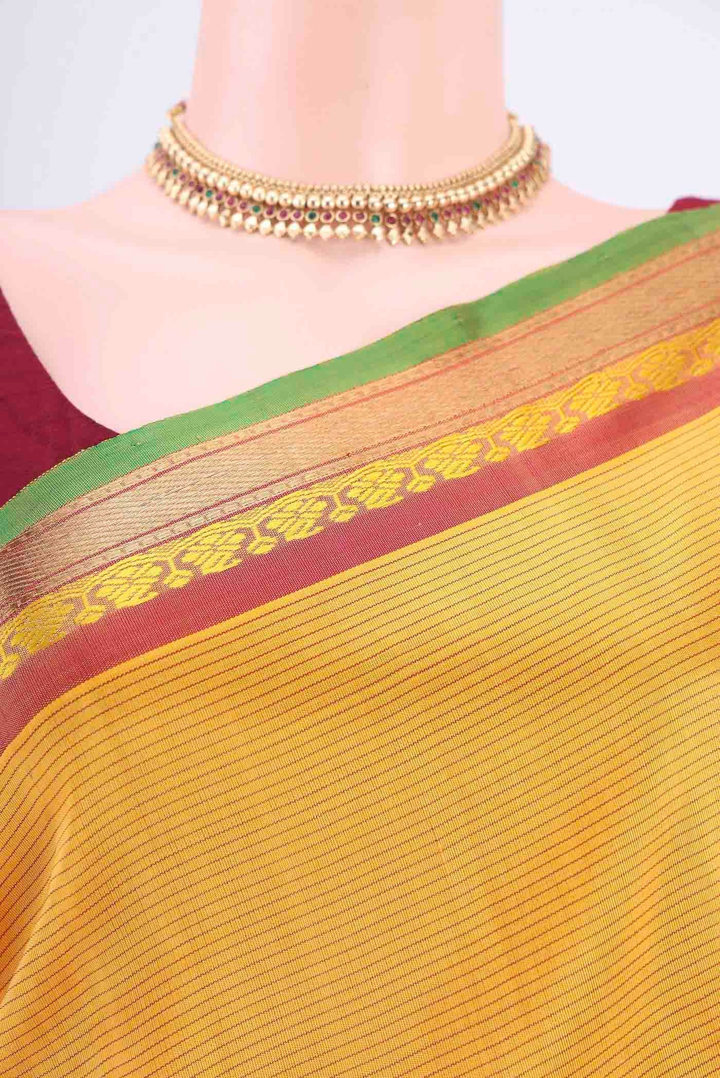 Border image of Yellow Kanchipuram Silk Saree with Stripes on the body and Zari And Thread Border