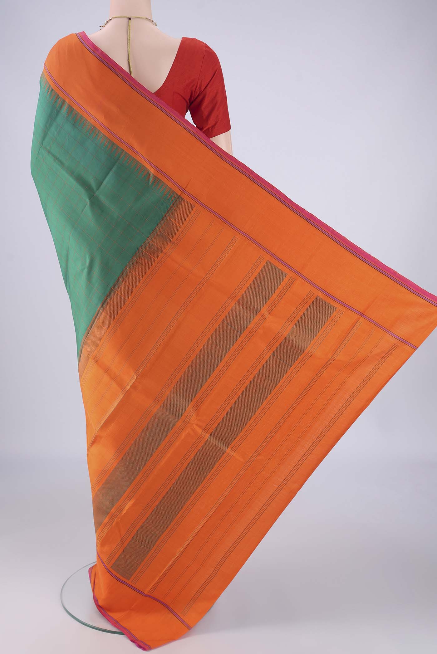Flat view of Green Kanchipuram Silk Saree with Checked design on the body and Temple Thread Border. 