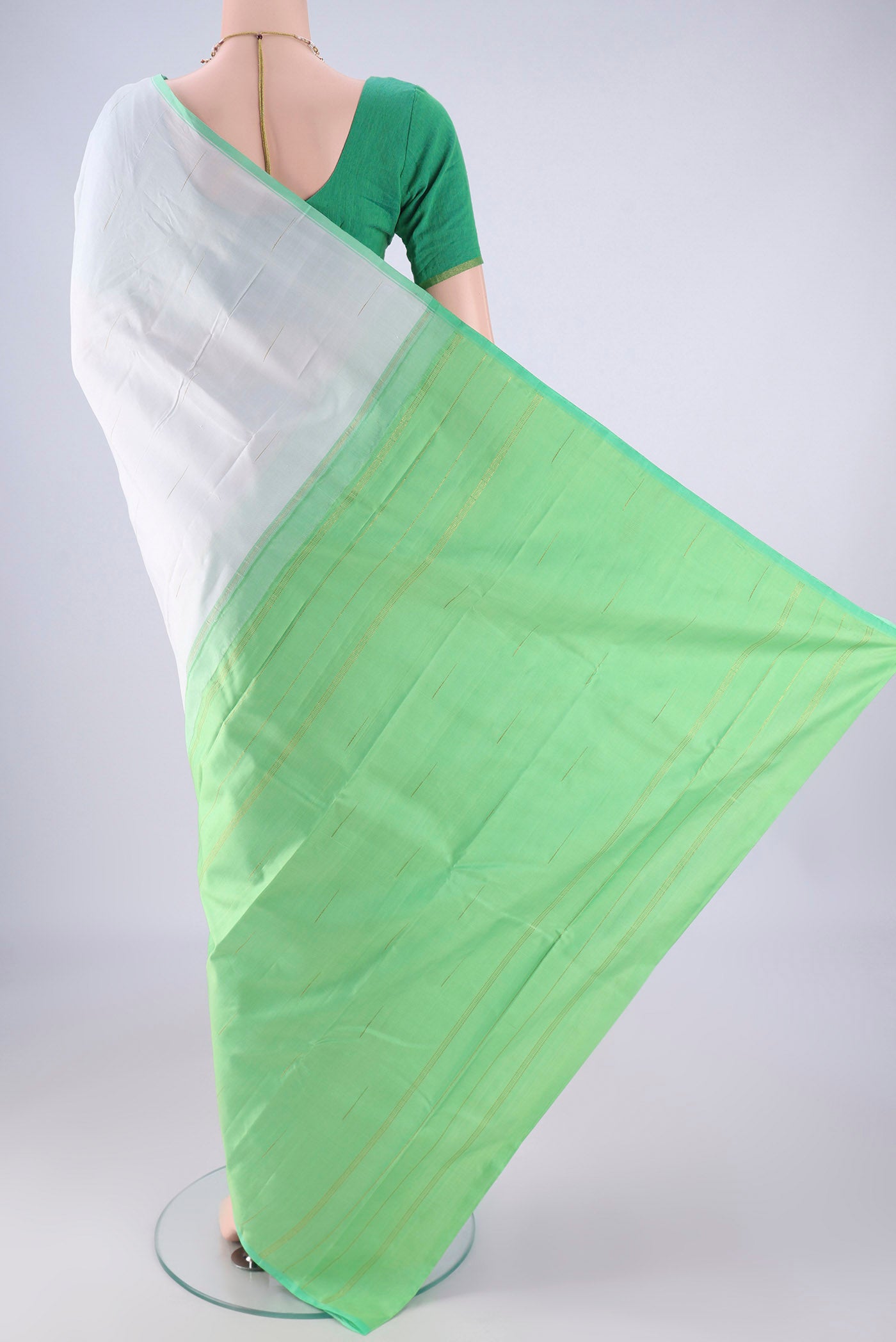 Flat view of Sky Blue Kanjivaram Silk Saree with Zari Butta on the body and Plain Border. 