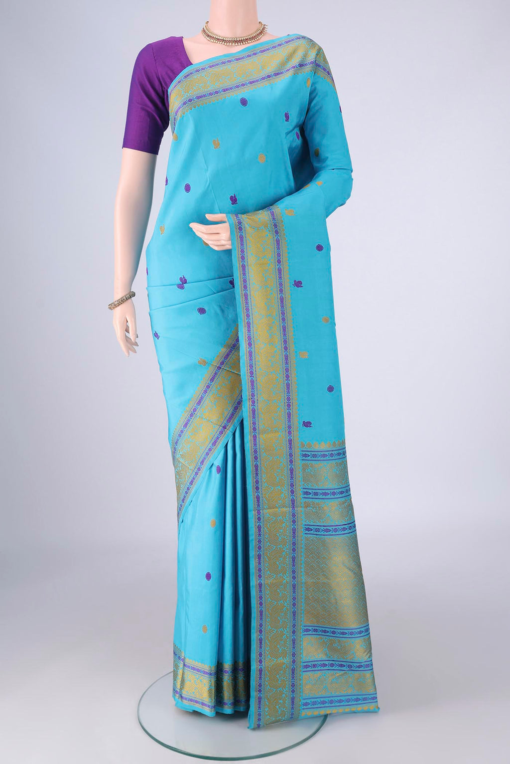 Sky Blue Kanchipuram Silk Saree with Thread Butta on the body and Thread Border.  displayed on a mannequin