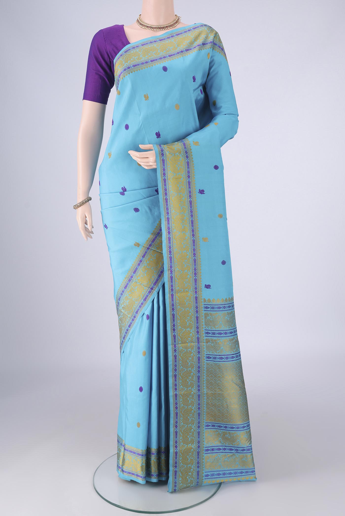 Sky Blue Kanchipuram Silk Saree with Thread Butta on the body and Thread Border.  displayed on a mannequin