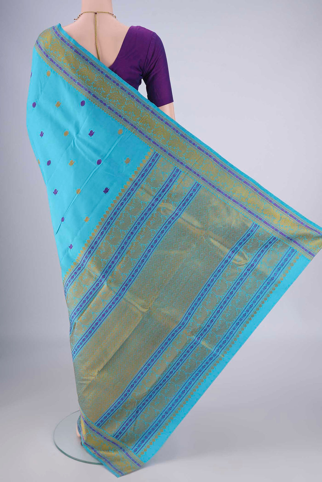 Flat view of Sky Blue Kanchipuram Silk Saree with Thread Butta on the body and Thread Border. 