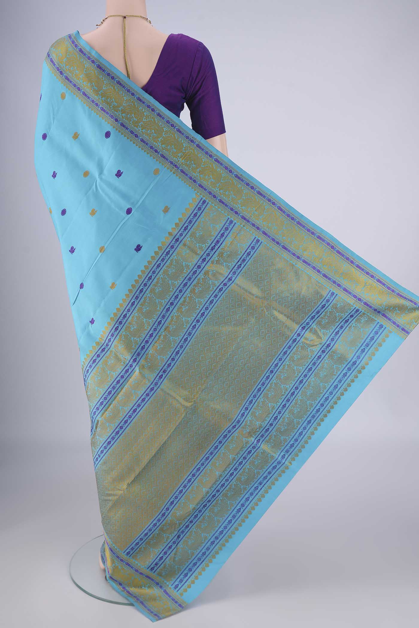Flat view of Sky Blue Kanchipuram Silk Saree with Thread Butta on the body and Thread Border. 