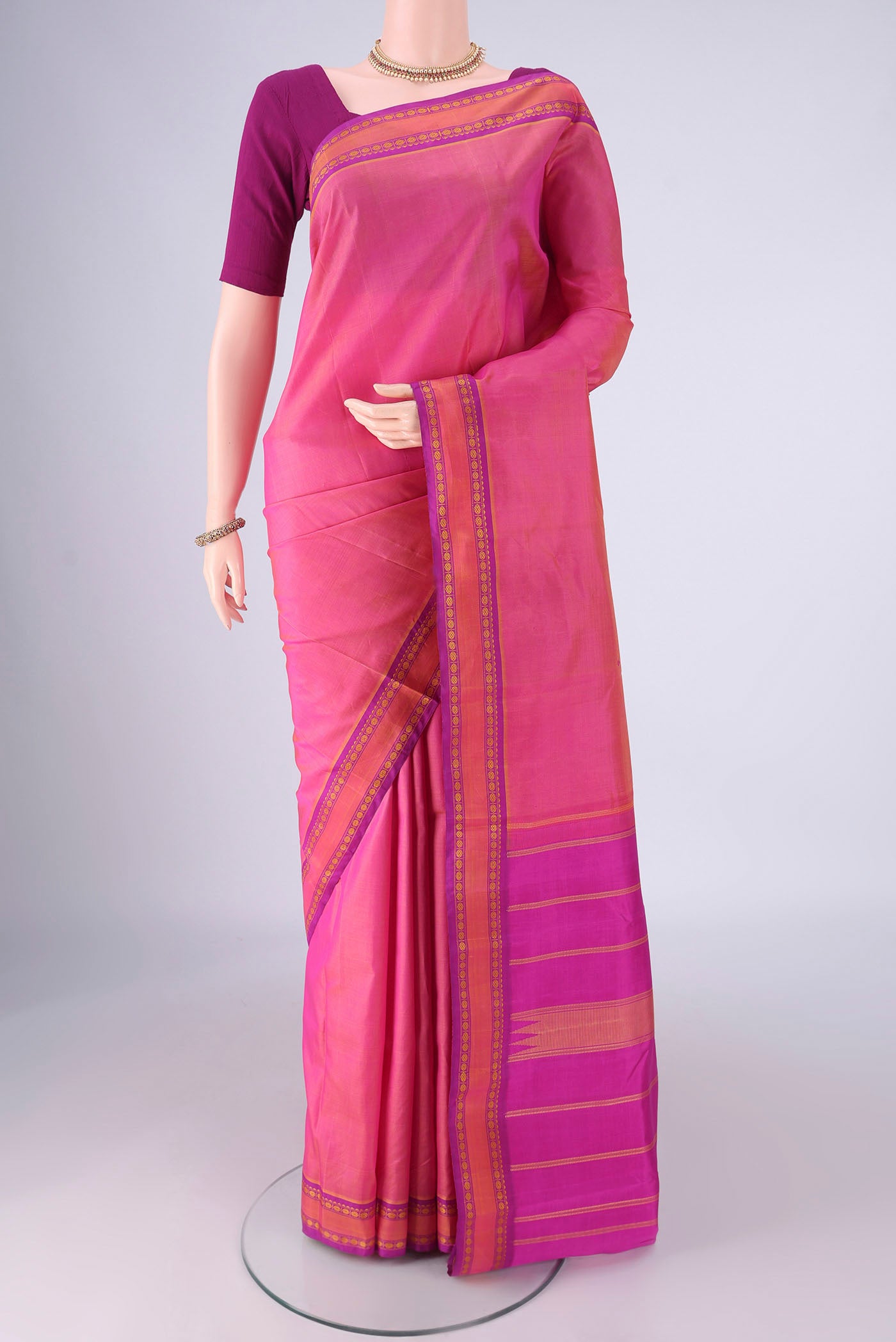 Pink Dual Tone Kanjivaram Silk Saree with Checked design on the body and Thread Border.  displayed on a mannequin