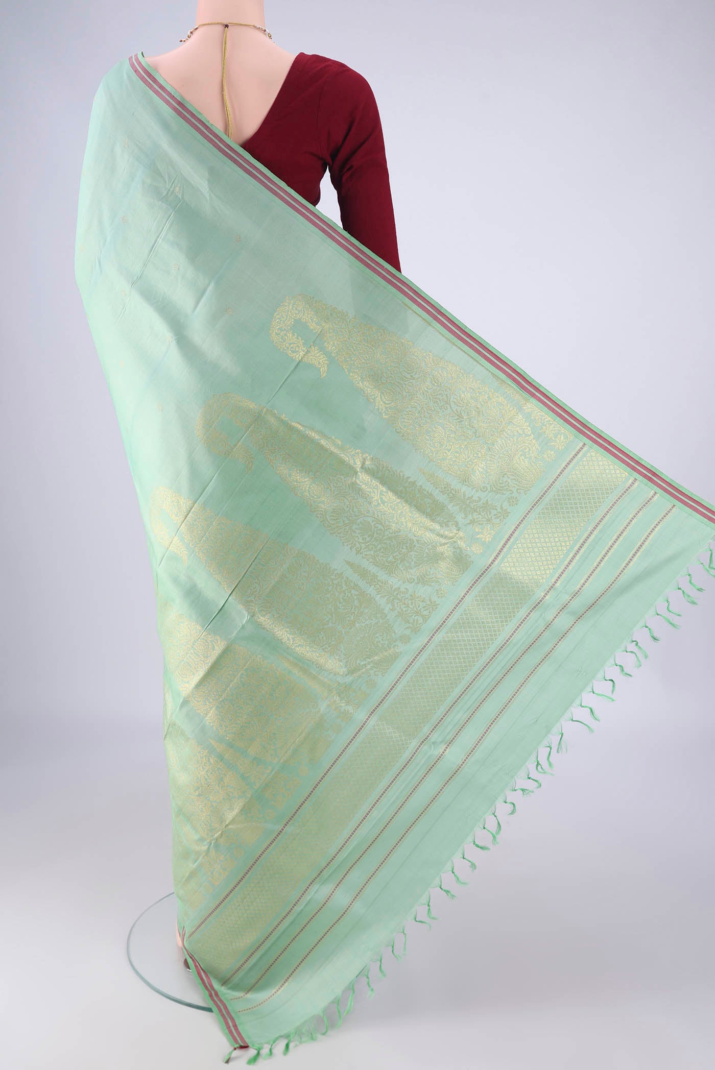Flat view of Sea Green Kanchipuram Silk Saree with Zari Butta on the body and Plain Border. 