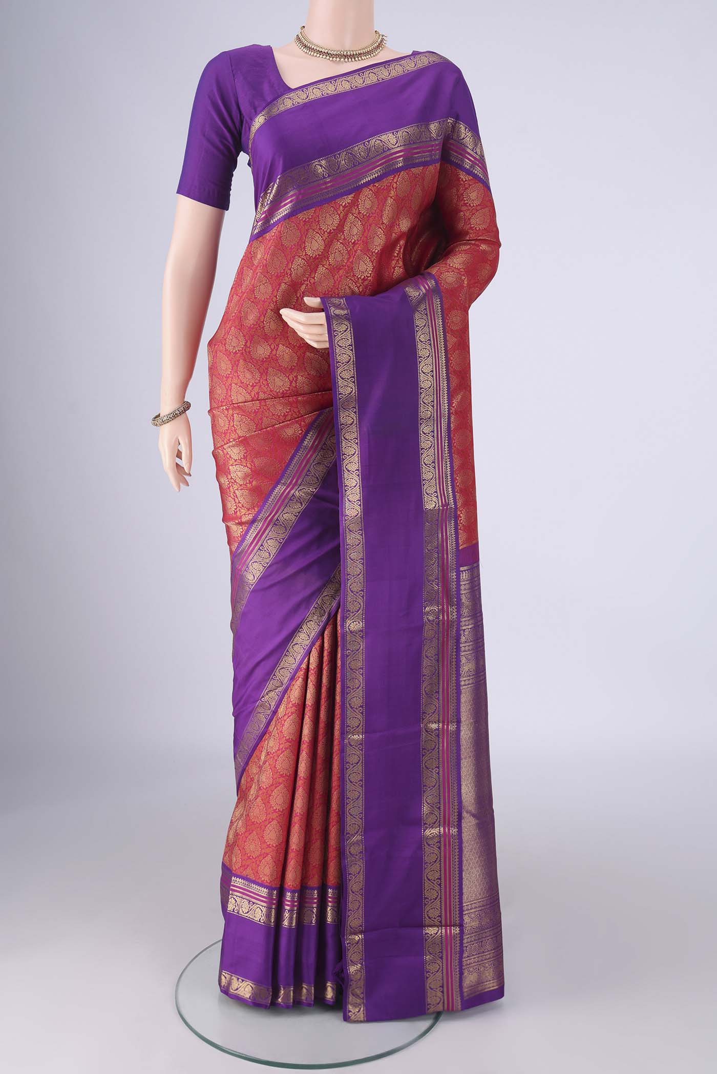 Pure Silk Pure Zari Red Kanjivaram Saree with Zari Brocade on the body and Zari Border.  displayed on a mannequin