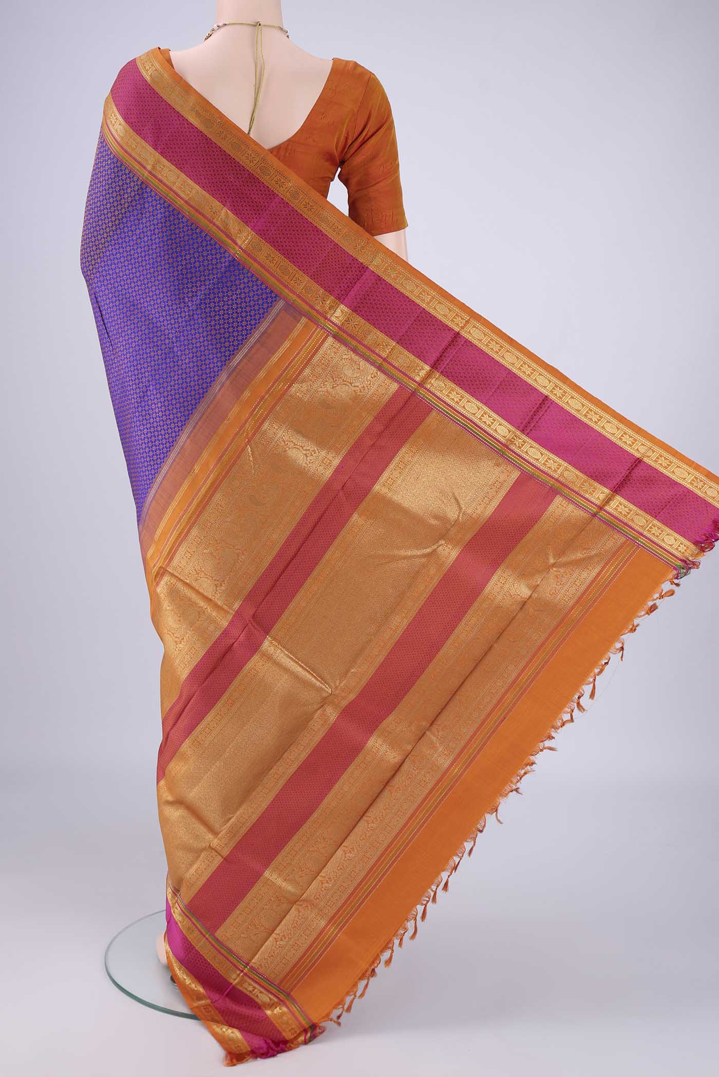Flat view of Violet Kanjivaram Silk Saree with Jacquard design on the body and Zari Border. 