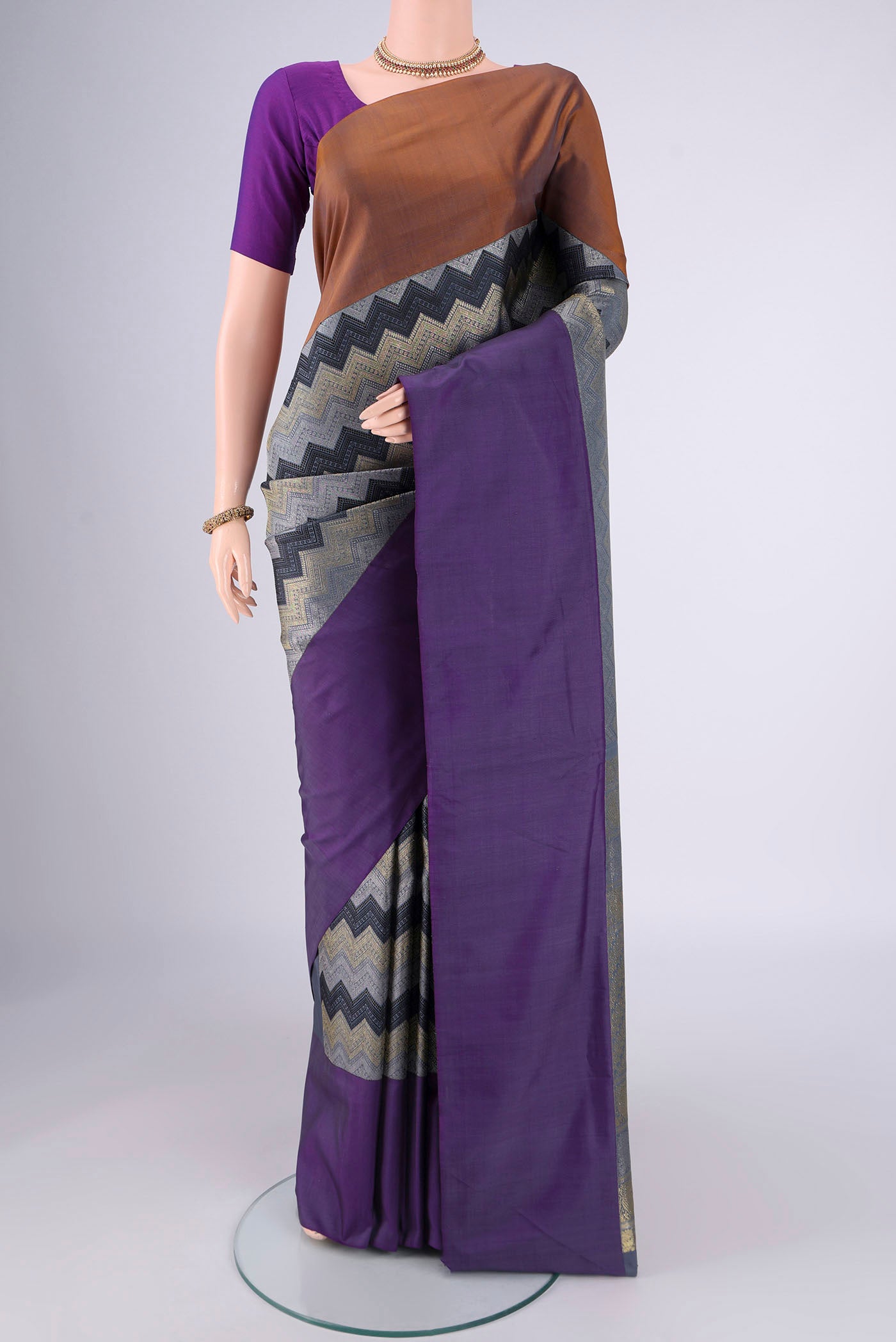 Pure Silk Pure Zari Lilac Kanjivaram Saree with Jacquard design on the body and Ganga Jamuna Border.  displayed on a mannequin