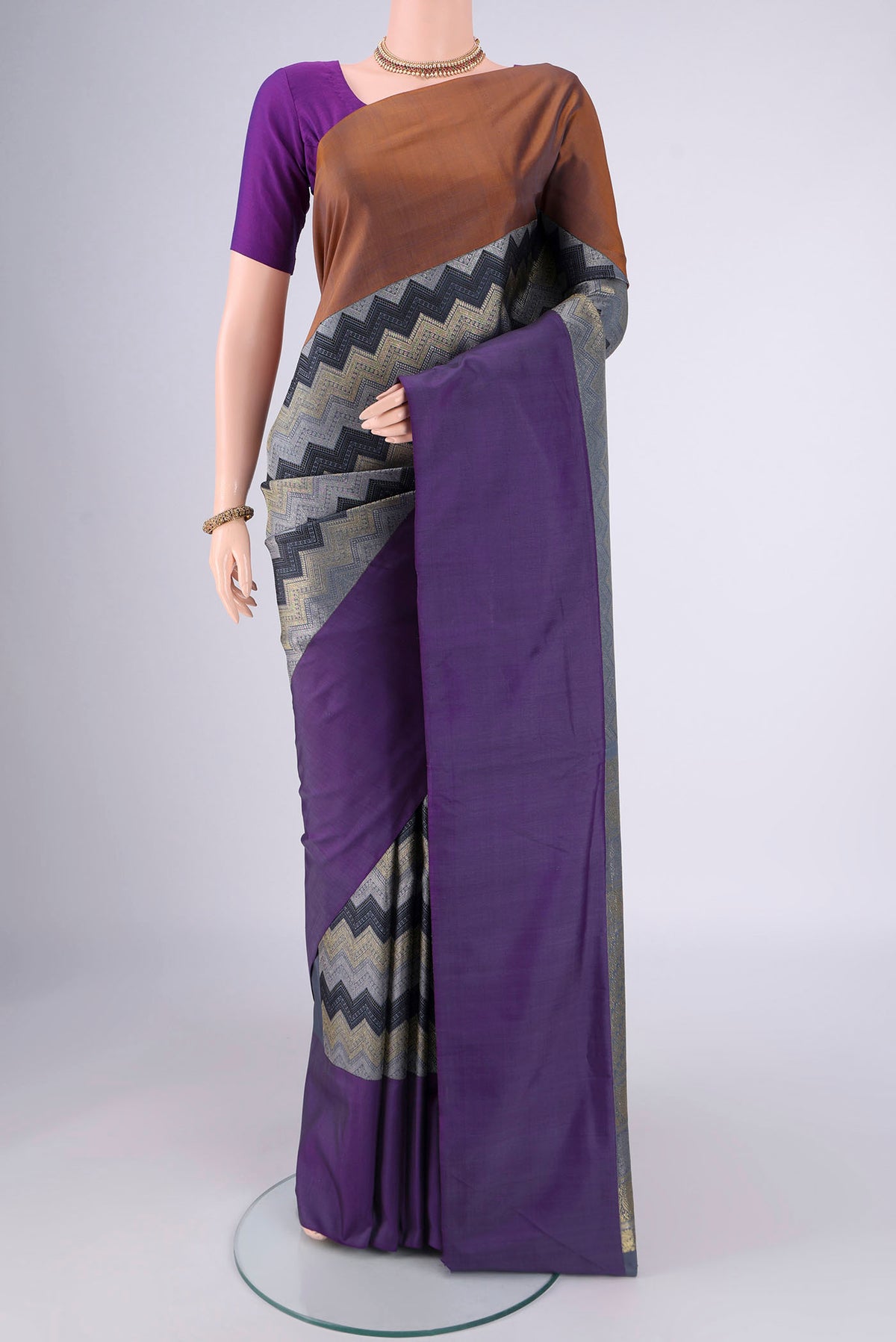 Pure Silk Pure Zari Lilac Kanjivaram Saree with Jacquard design on the body and Ganga Jamuna Border.  displayed on a mannequin