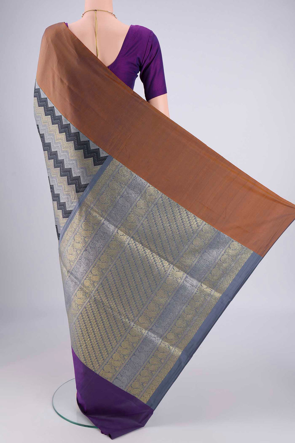 Flat view of Pure Silk Pure Zari Lilac Kanjivaram Saree with Jacquard design on the body and Ganga Jamuna Border. 