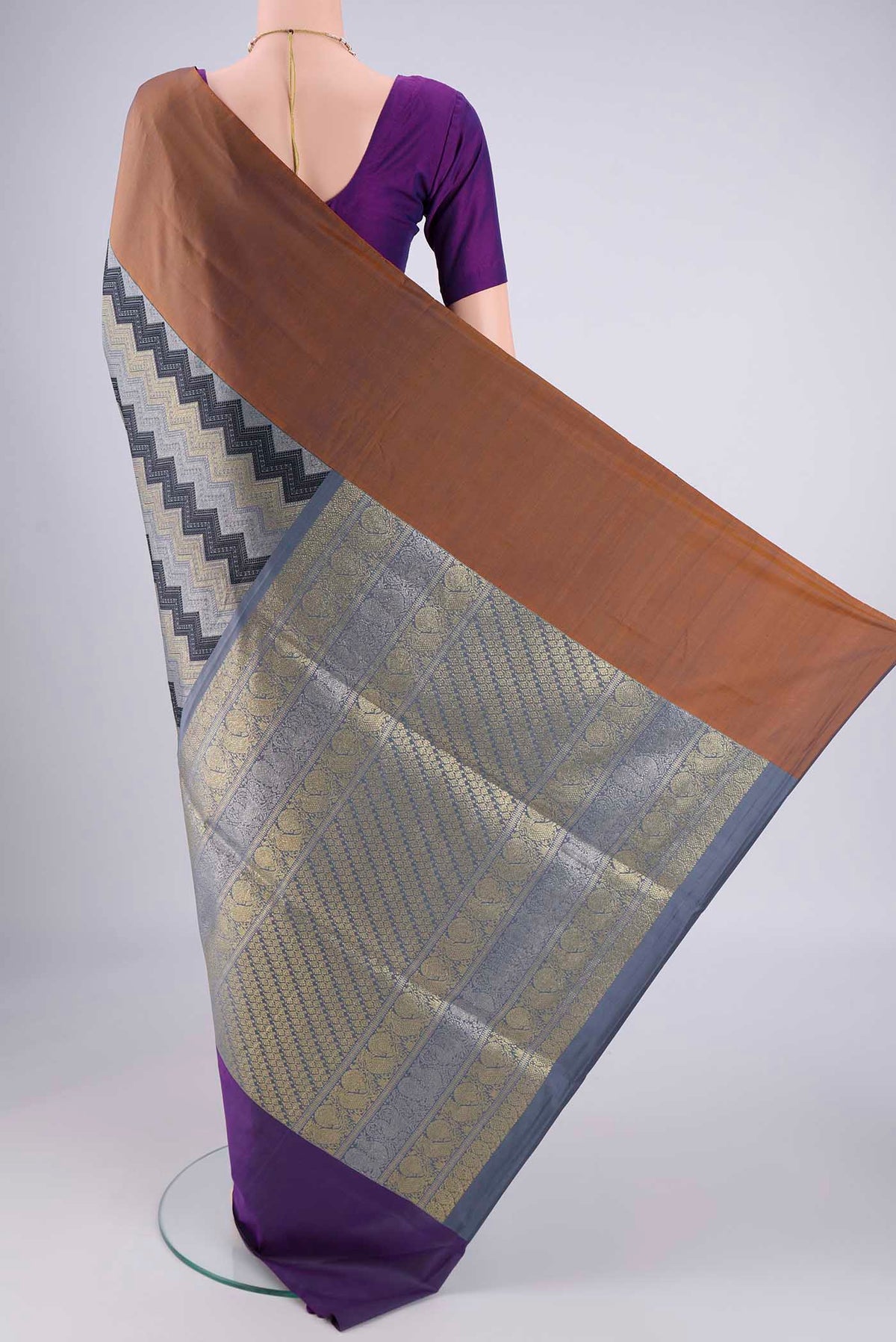 Flat view of Pure Silk Pure Zari Lilac Kanjivaram Saree with Jacquard design on the body and Ganga Jamuna Border. 