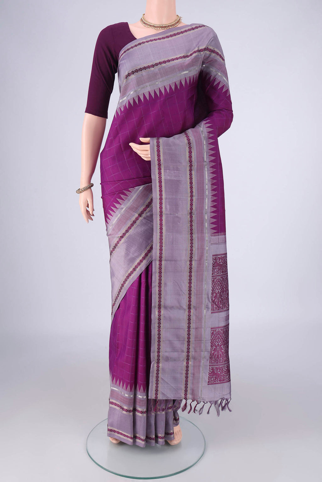 Purple Kanjivaram Silk Saree with Checked design on the body and Zari And Thread Border.  displayed on a mannequin