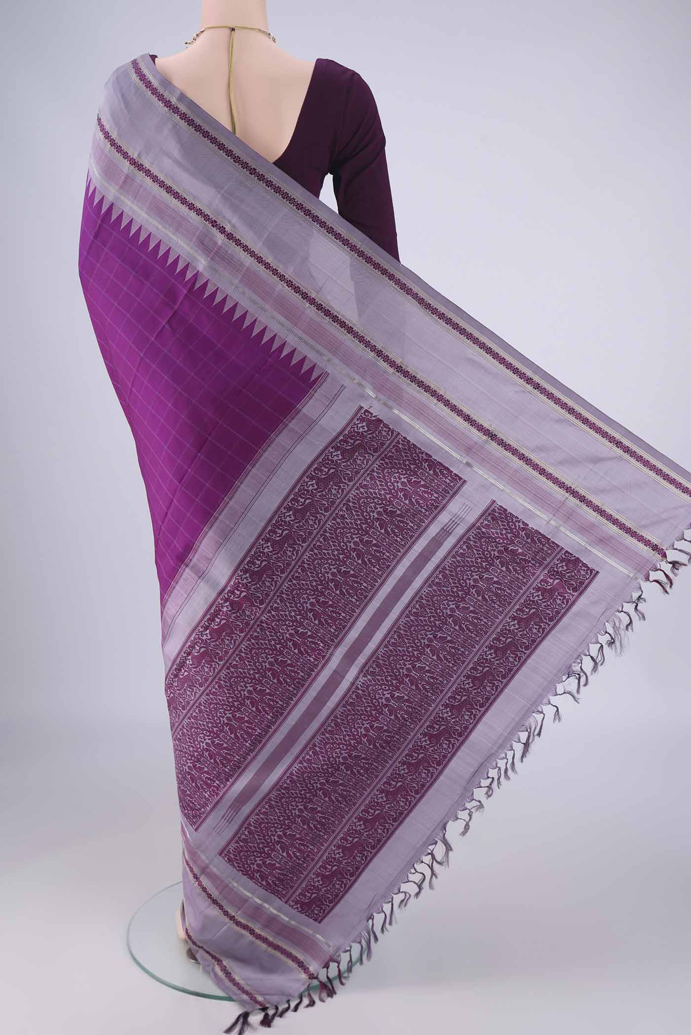 Flat view of Purple Kanjivaram Silk Saree with Checked design on the body and Zari And Thread Border. 