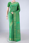 Pure Silk Pure Zari Green Kanjivaram Saree with Zari Brocade on the body and Zari Border.  displayed on a mannequin
