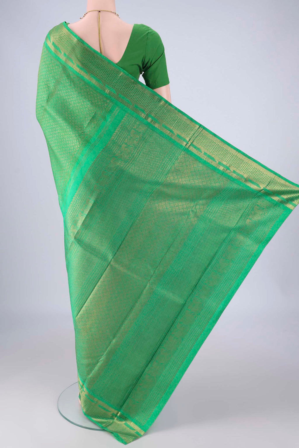 Flat view of Pure Silk Pure Zari Green Kanjivaram Saree with Zari Brocade on the body and Zari Border. 