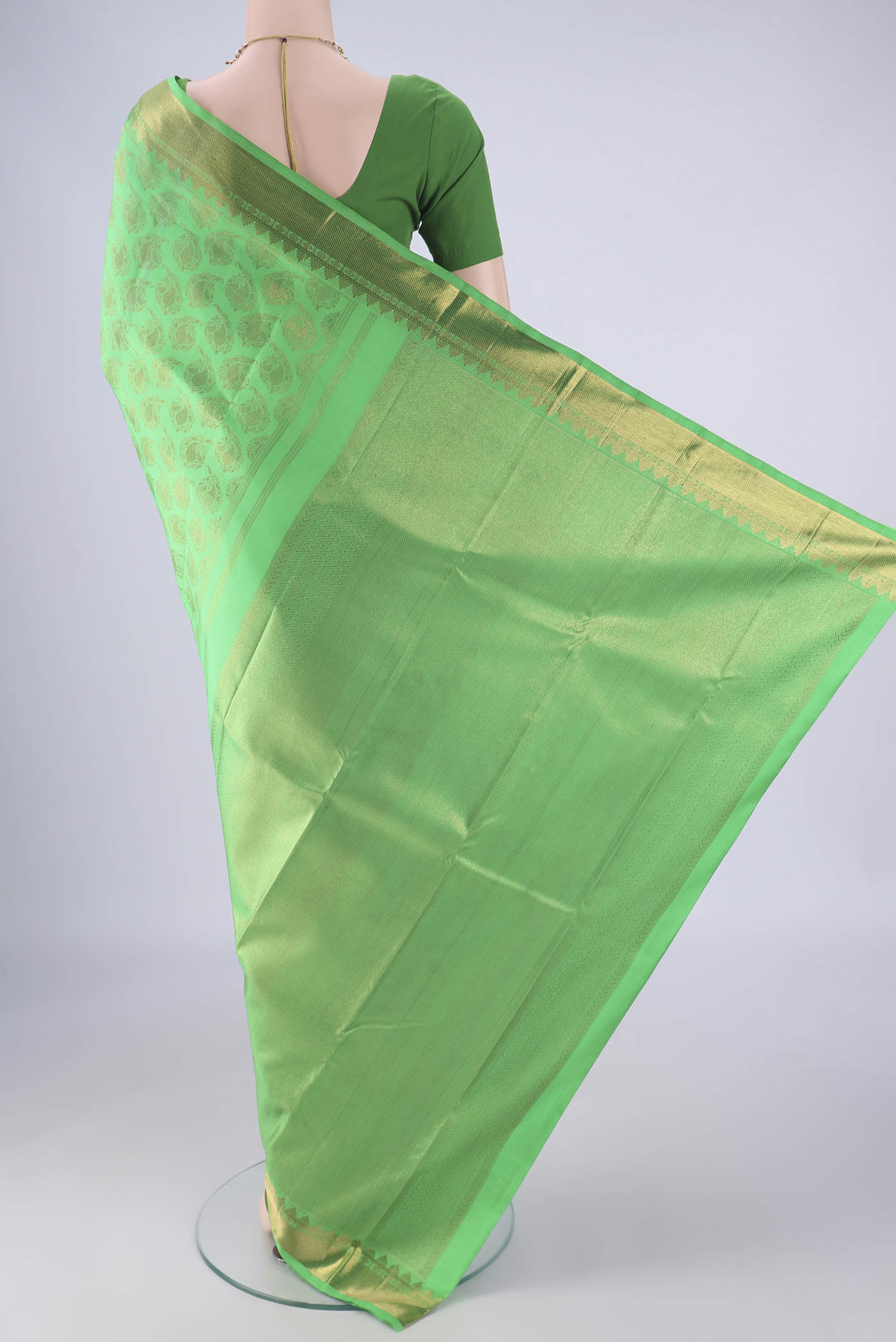 Flat view of Pure Silk Pure Zari Green Kanjivaram Saree with Zari Brocade on the body and Zari Border. 