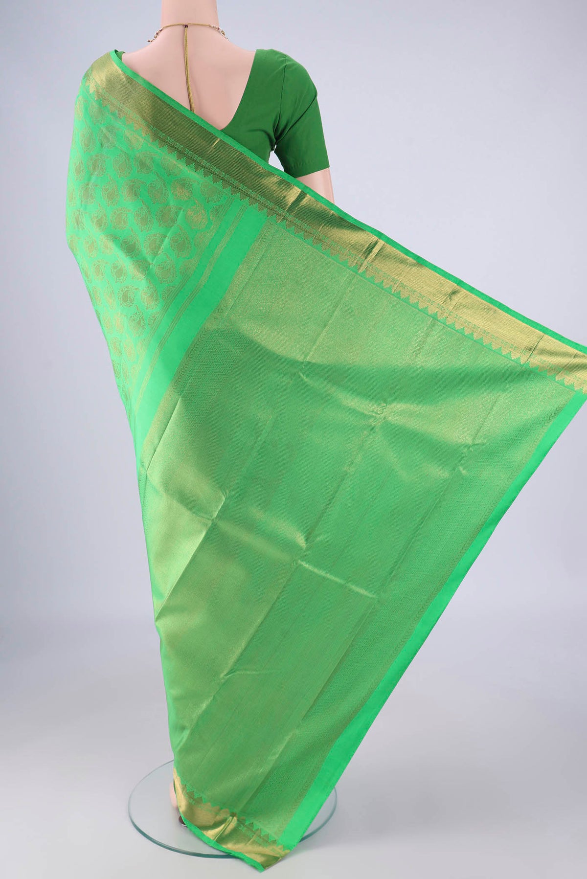 Flat view of Pure Silk Pure Zari Green Kanjivaram Saree with Zari Brocade on the body and Zari Border. 