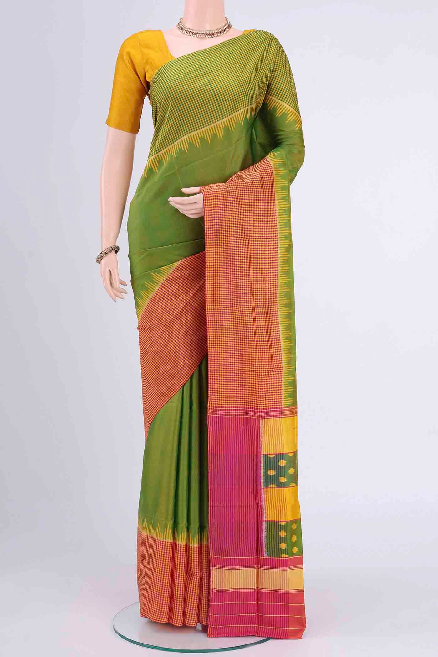 Light Green Rajkot Patola Silk Saree with Pure Ikat on the body and Zari Border displayed on a mannequin