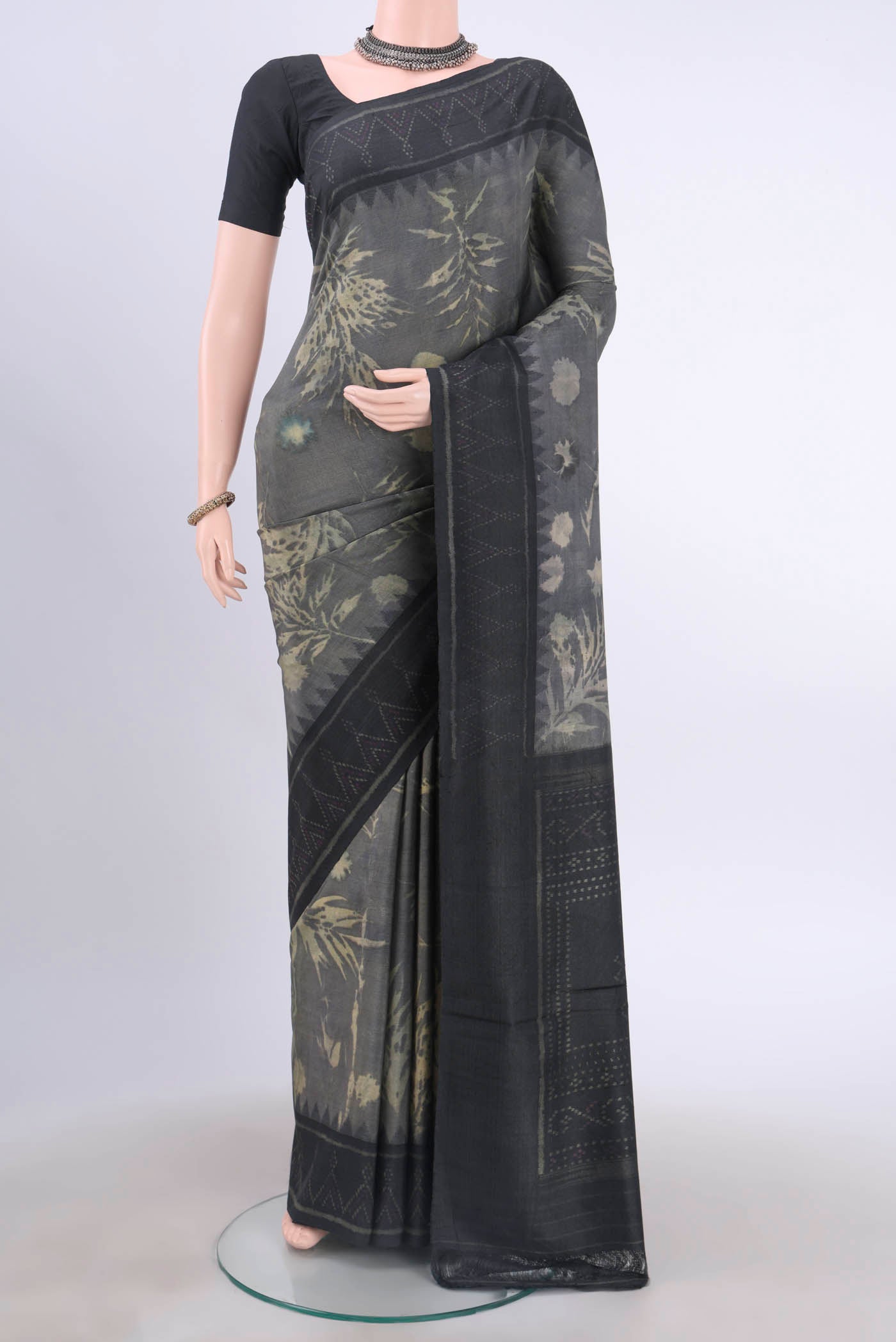 Davys Grey Tussar Silk Saree with Ajrakh Print on the body and Printed Border displayed on a mannequin
