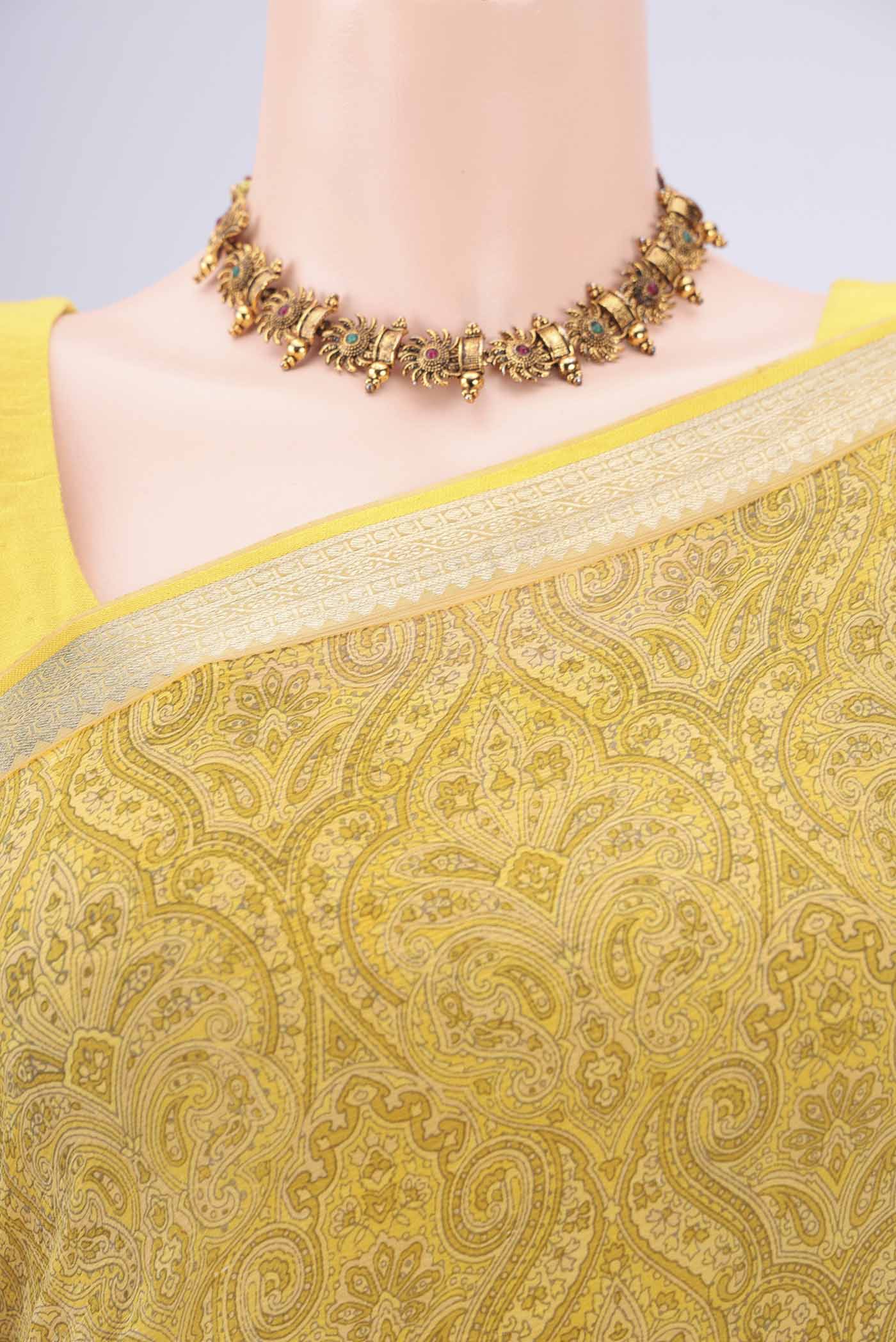 Border image of Light Green Mysore Chiffon Saree with Floral Print on the body and Zari Border. 