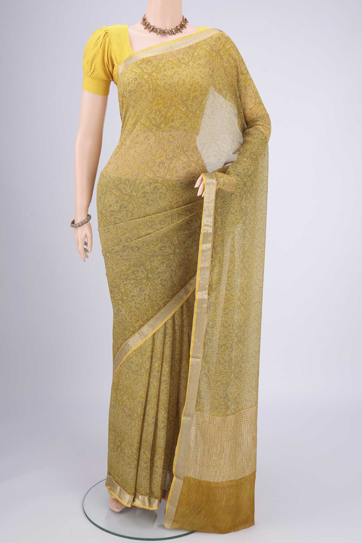 Light Green Mysore Chiffon Saree with Floral Print on the body and Zari Border.  displayed on a mannequin