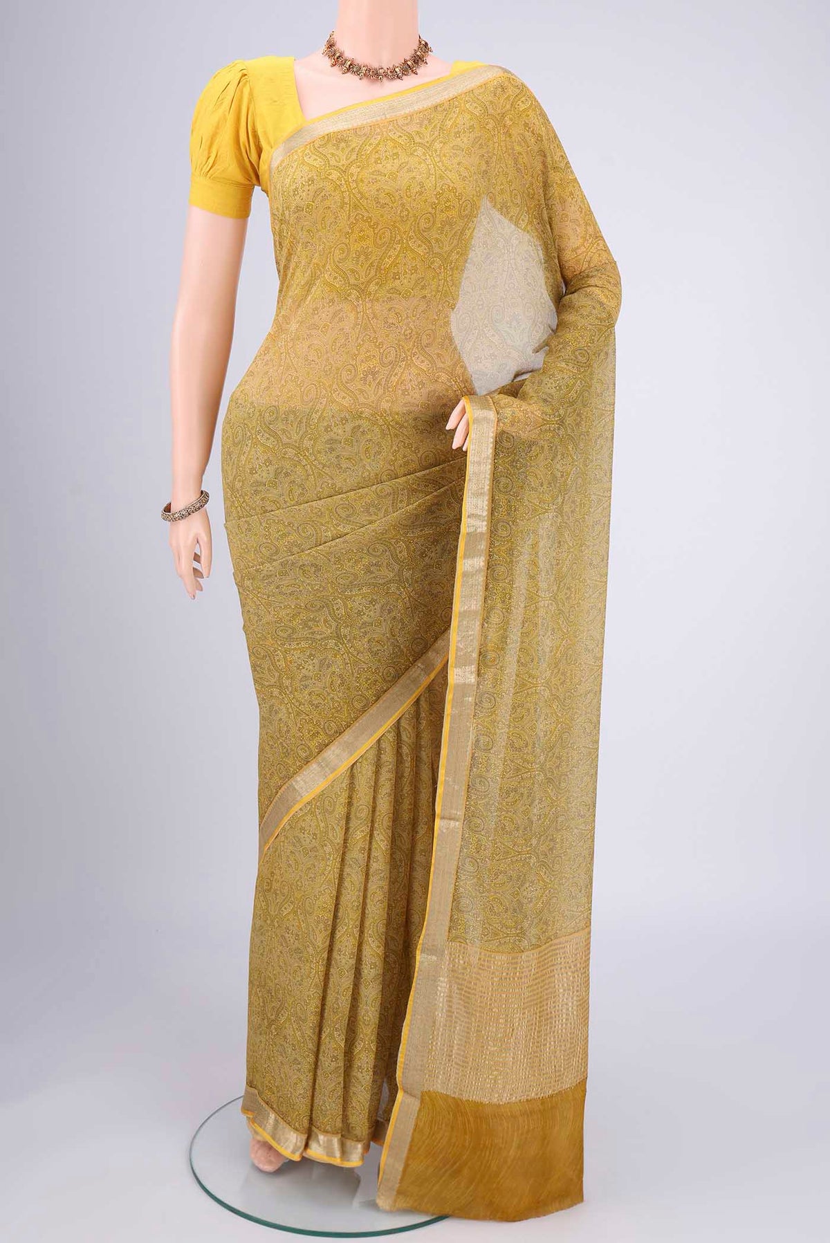 Light Green Mysore Chiffon Saree with Floral Print on the body and Zari Border.  displayed on a mannequin