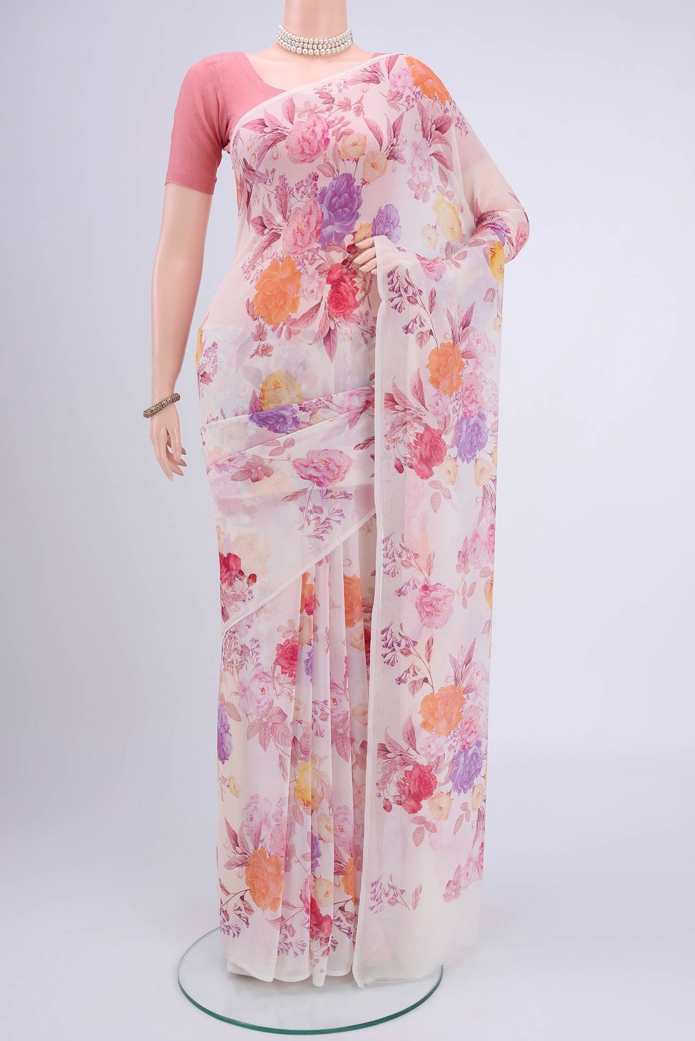 Peach Mysore Chiffon Saree with Floral Print on the body and Without Border.  displayed on a mannequin