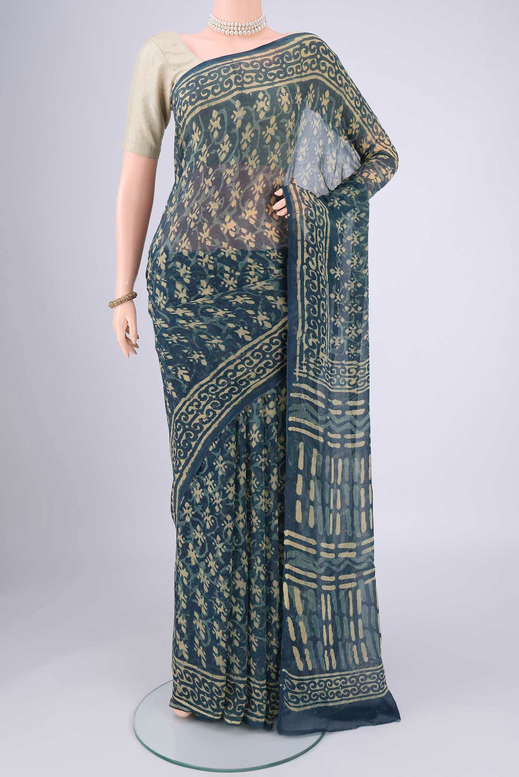 Indigo Mysore Chiffon Saree with Batik Print on the body and Printed Border.  displayed on a mannequin