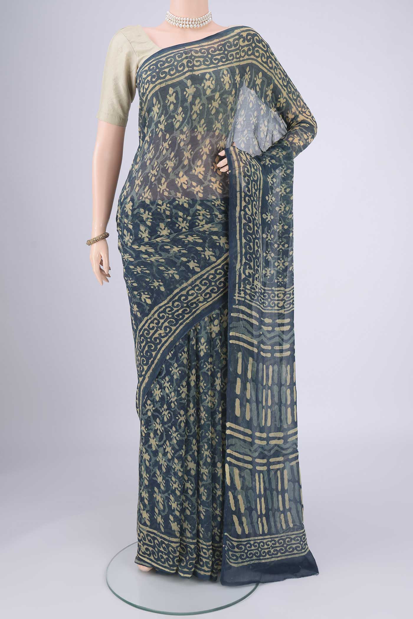 Indigo Mysore Chiffon Saree with Batik Print on the body and Printed Border.  displayed on a mannequin