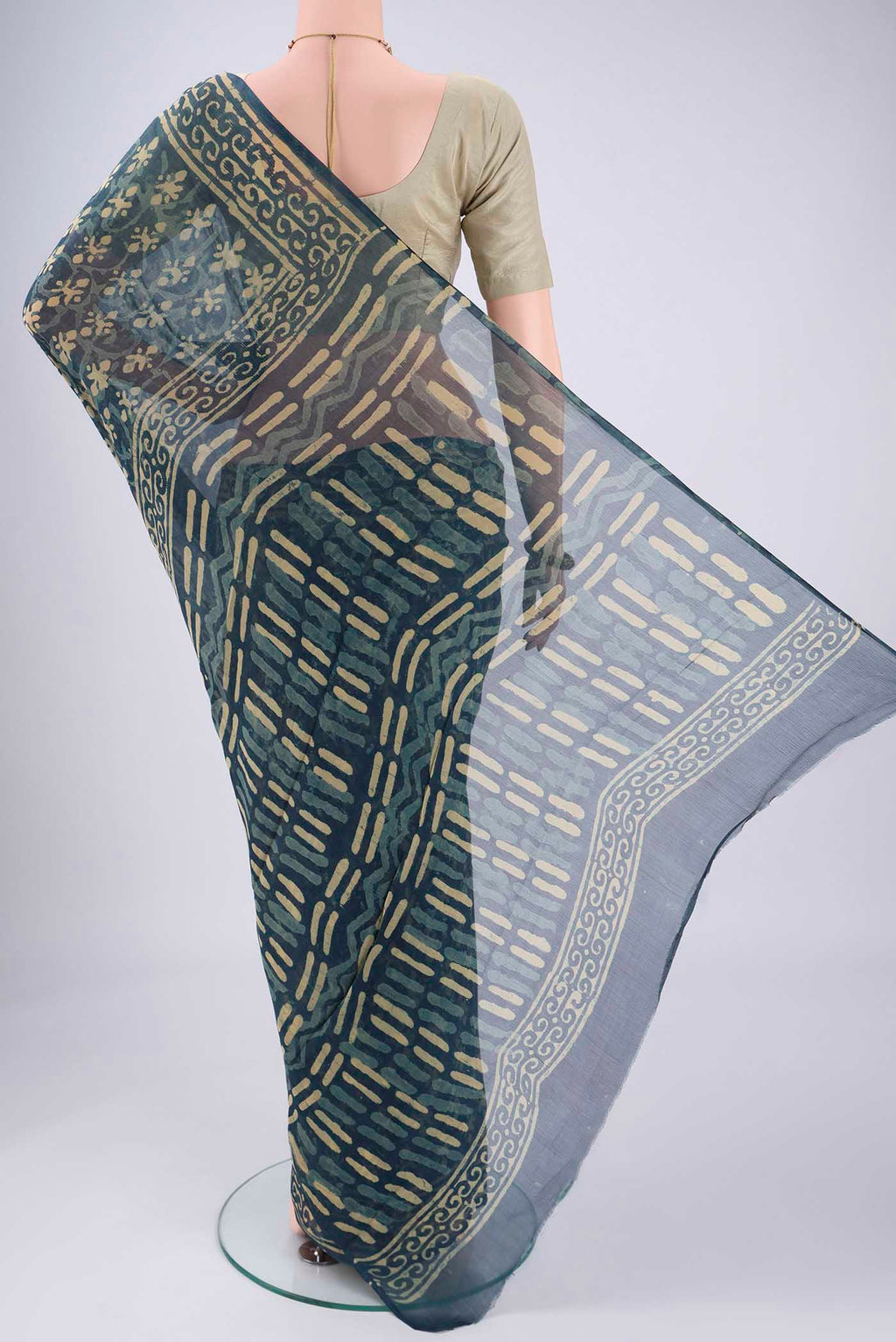 Flat view of Indigo Mysore Chiffon Saree with Batik Print on the body and Printed Border. 