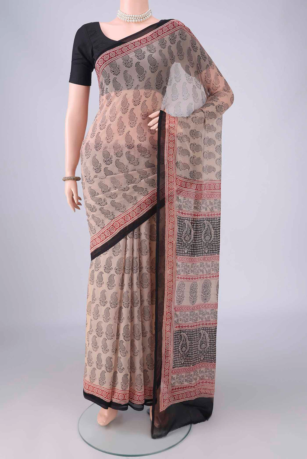 Beige Mysore Chiffon Saree with Floral Print on the body and Printed Border.  displayed on a mannequin