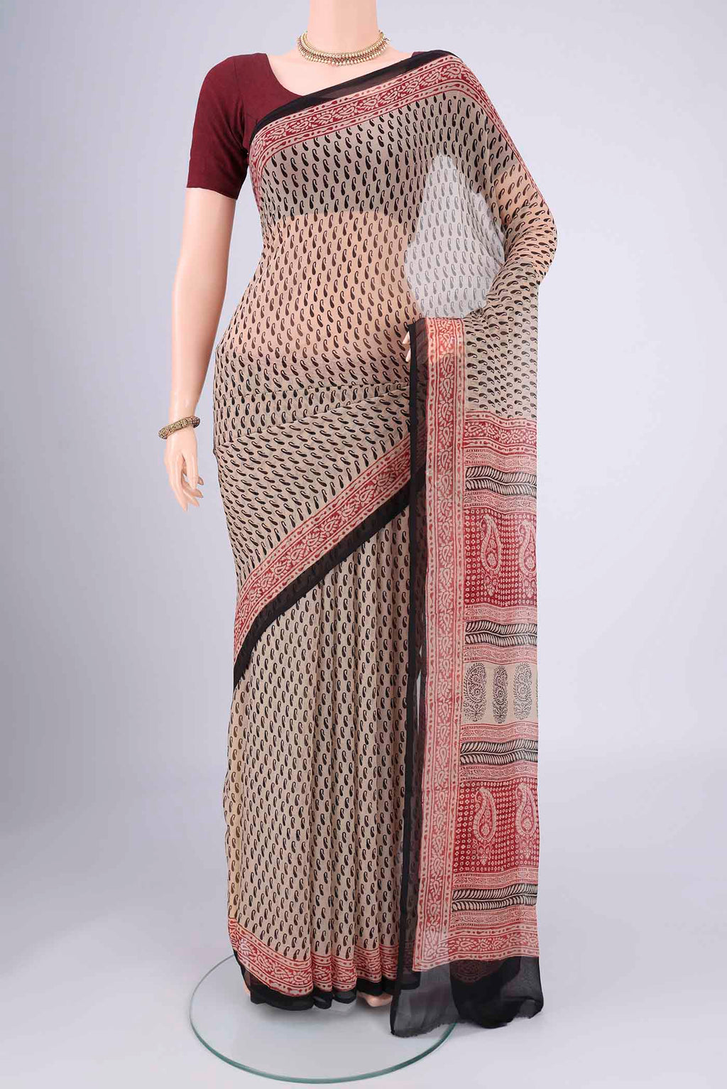 Beige Mysore Chiffon Saree with Floral Print on the body and Printed Border.  displayed on a mannequin