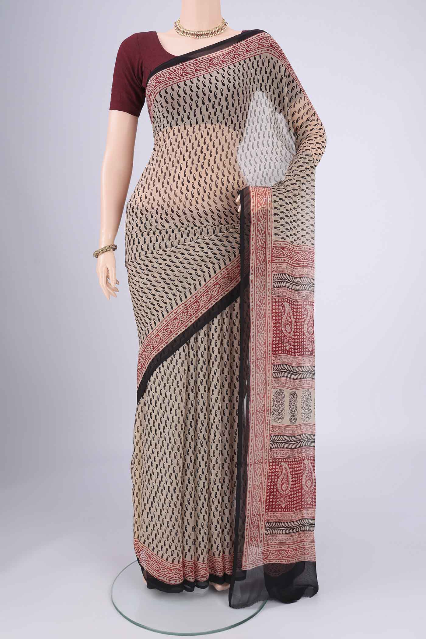 Beige Mysore Chiffon Saree with Floral Print on the body and Printed Border.  displayed on a mannequin