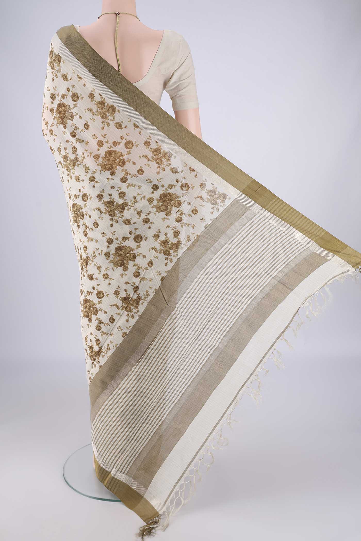 Flat view of Off White Tussar Silk Saree with Floral Print on the body and Plain Border. 