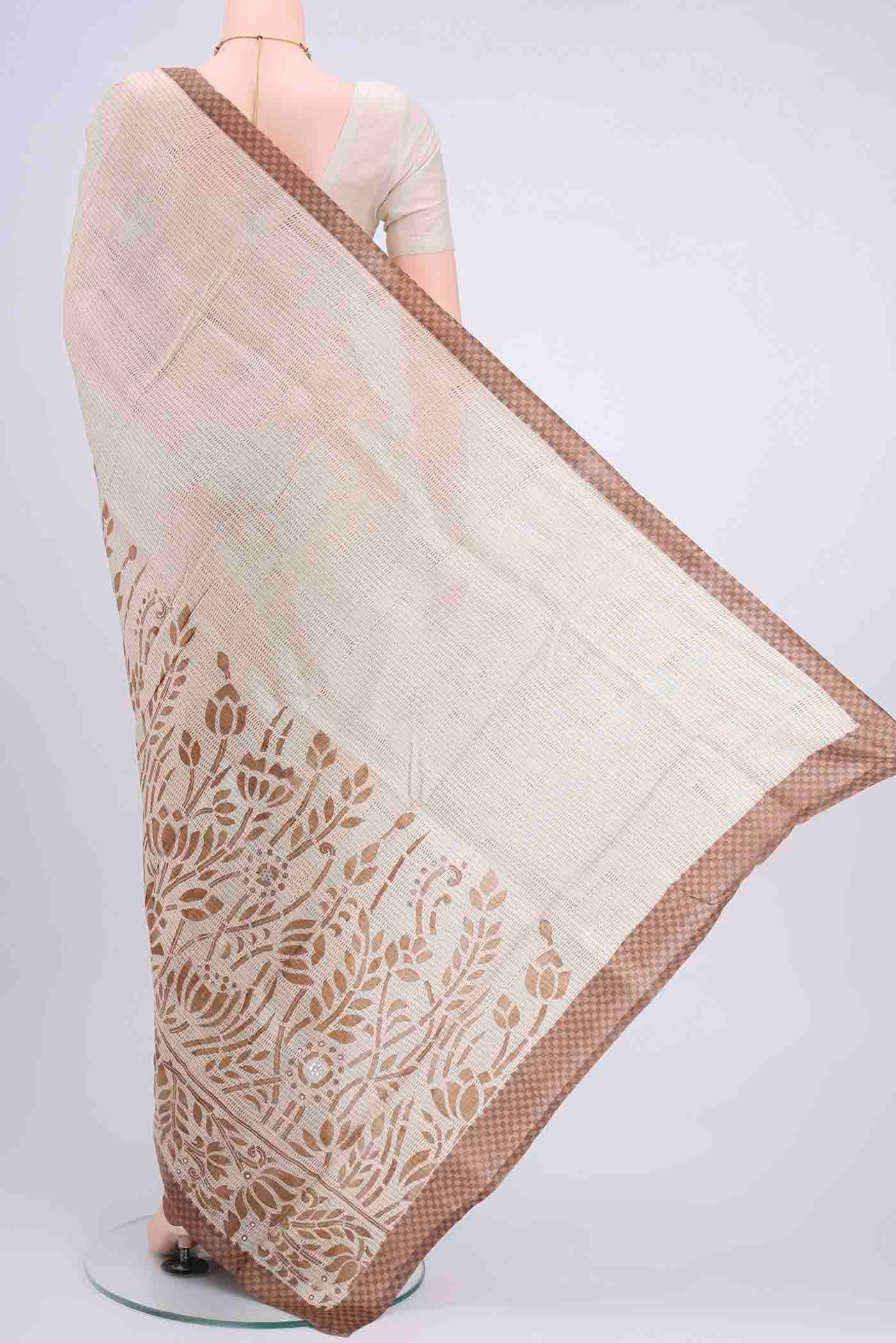 Flat view of Off White Printed Silk Saree with Embroidery on the body and Zari Border