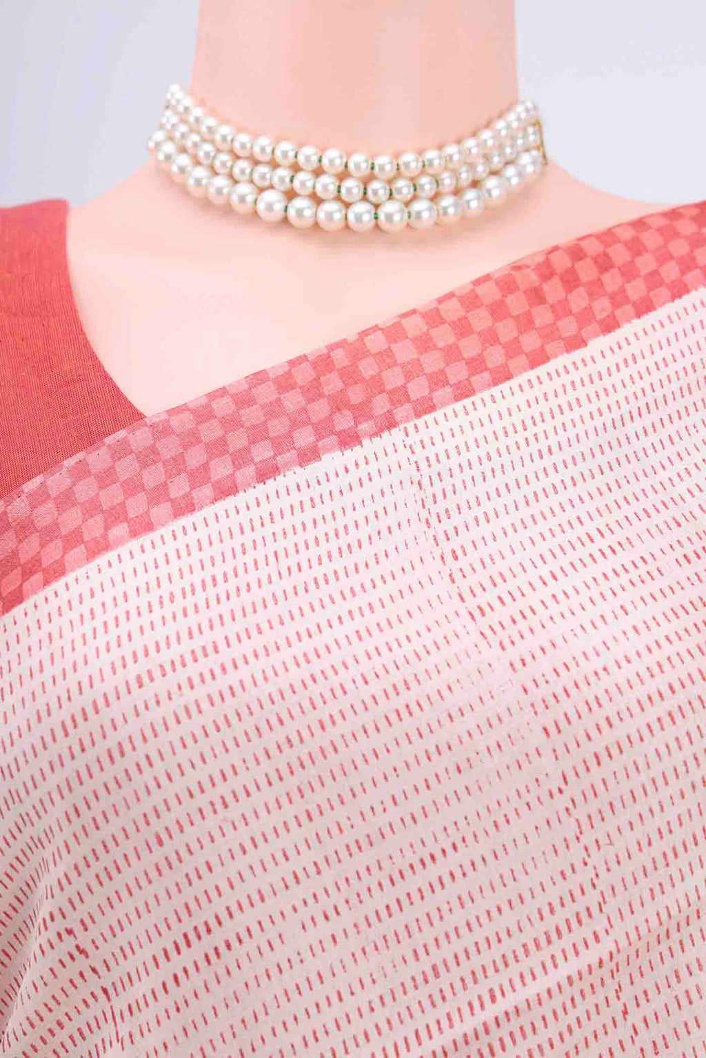 Border image of Off White Printed Silk Saree with Embroidery on the body and Zari Border