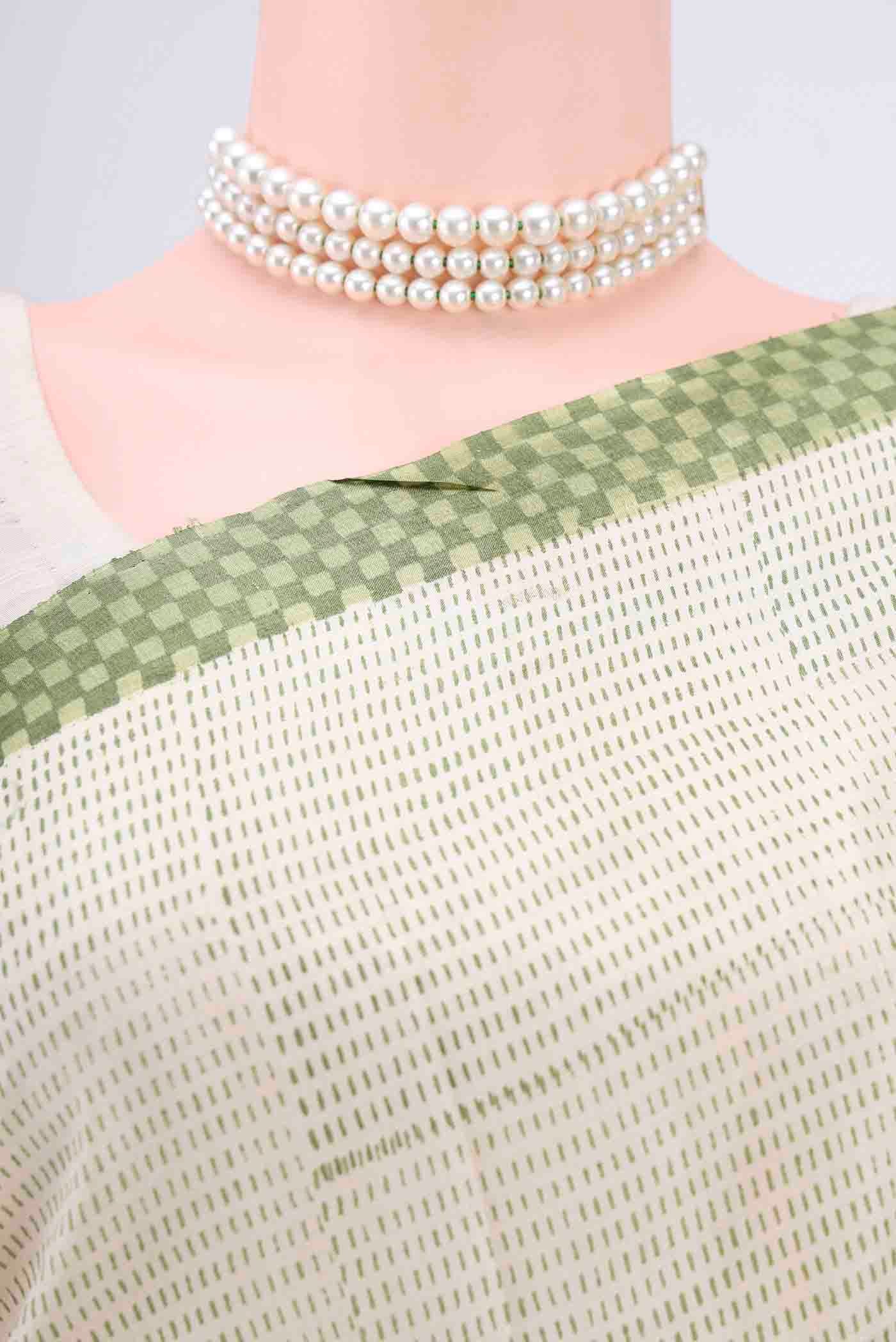 Border image of Off White Printed Silk Saree with Embroidery on the body and Zari Border