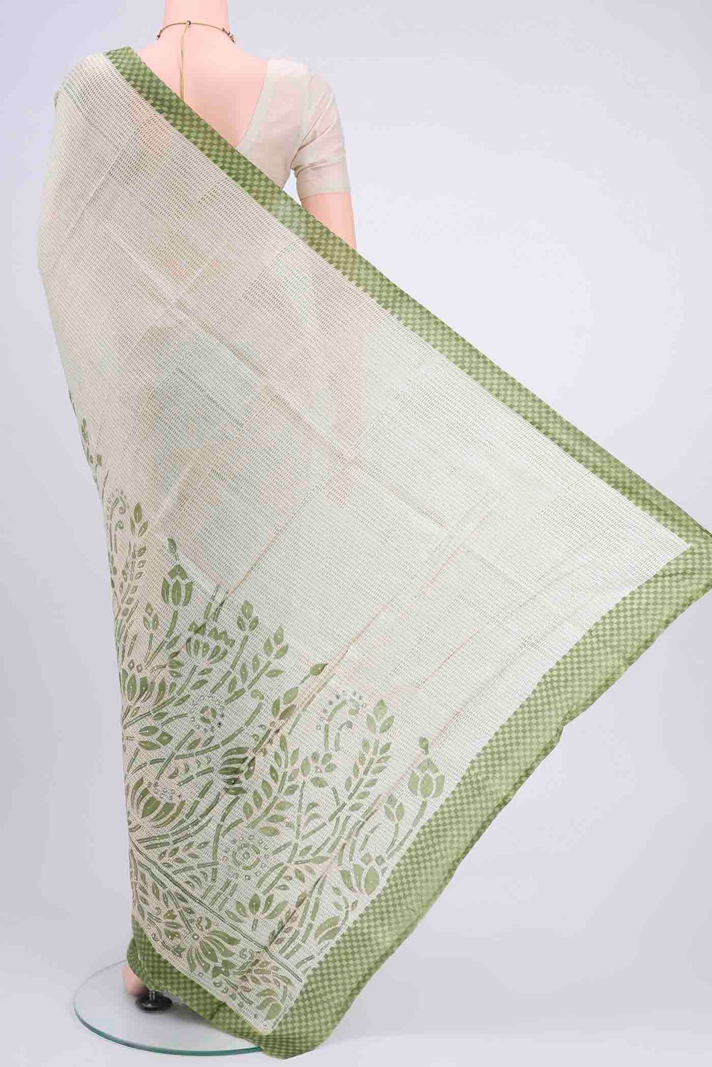 Flat view of Off White Printed Silk Saree with Embroidery on the body and Zari Border