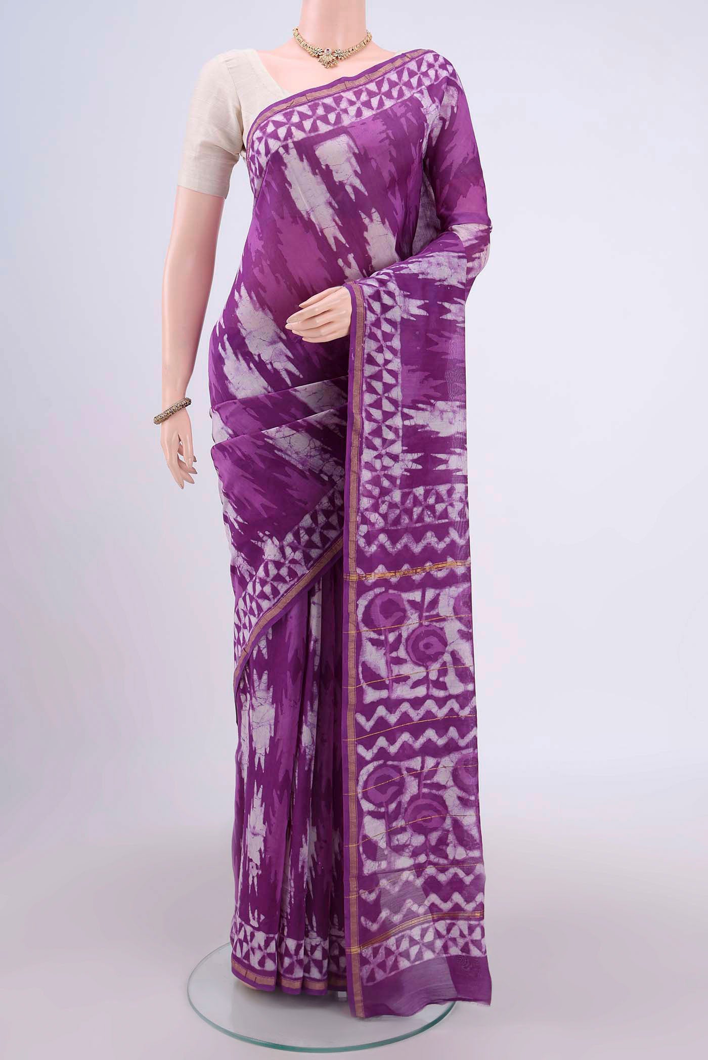 Magenta Chanderi Silk Cotton Saree with Printed design on the body and Zari Border.  displayed on a mannequin