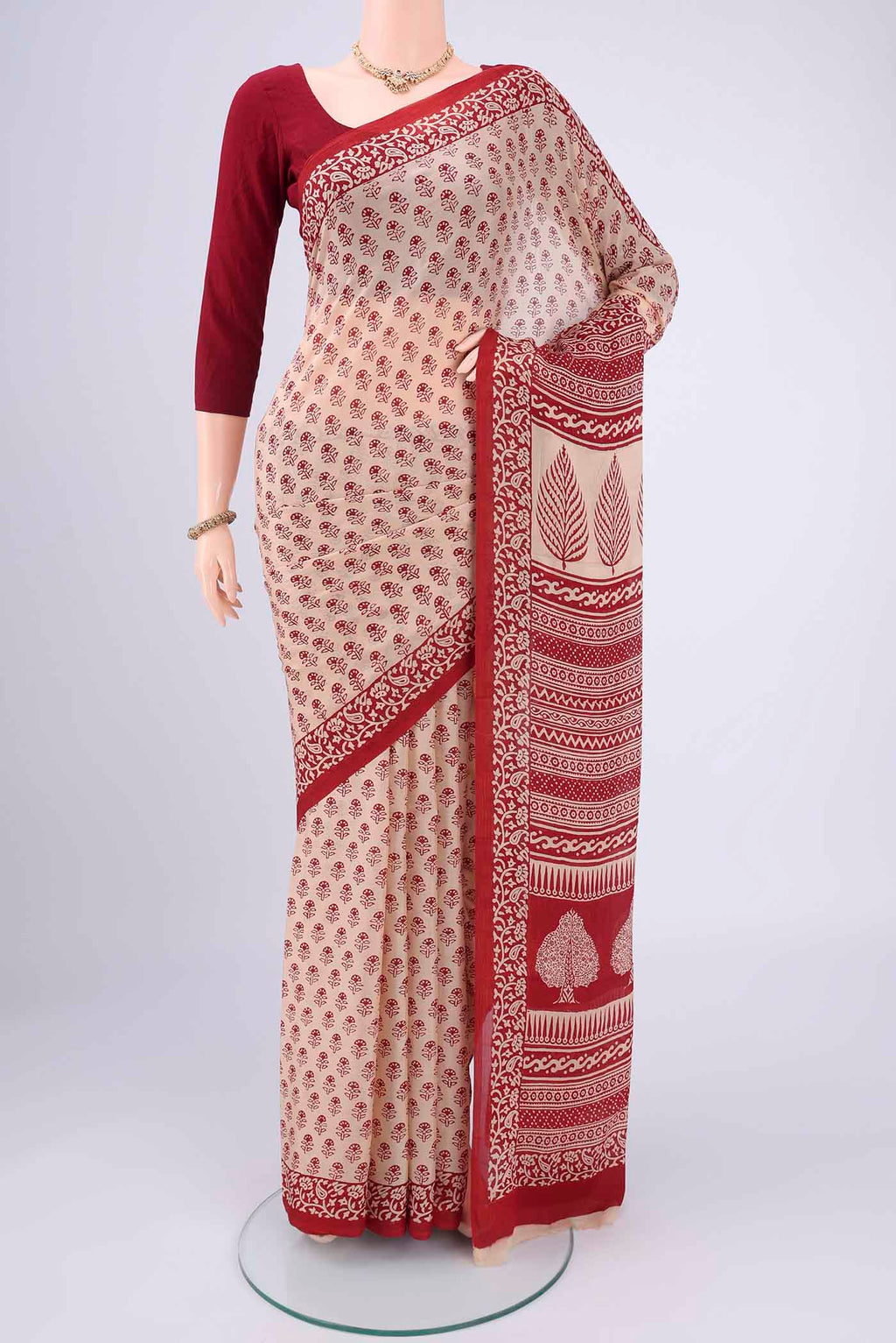 Beige Mysore Chiffon Saree with Floral Print on the body and Printed Border.  displayed on a mannequin