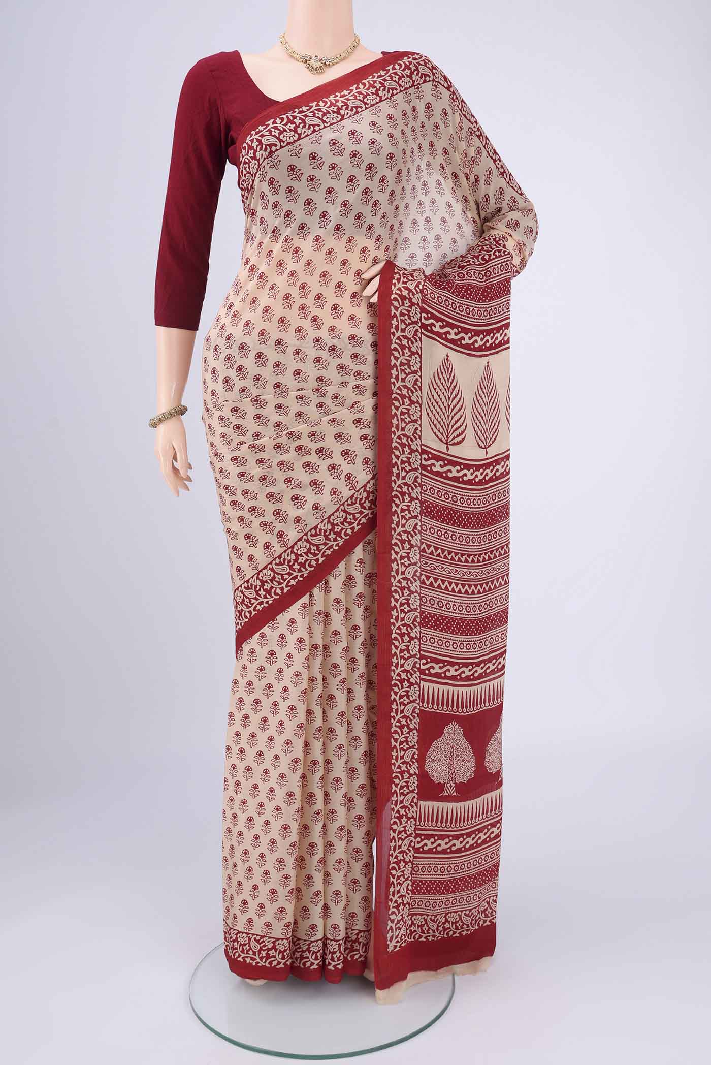 Beige Mysore Chiffon Saree with Floral Print on the body and Printed Border.  displayed on a mannequin