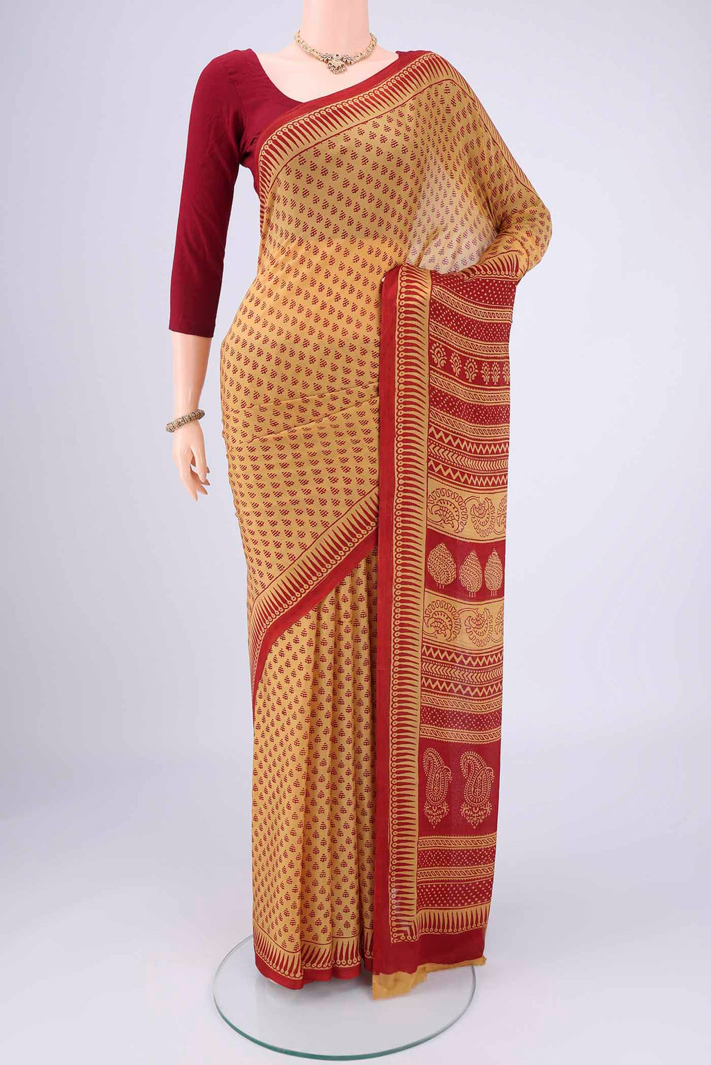 Mustard Mysore Chiffon Saree with Floral Print on the body and Printed Border.  displayed on a mannequin