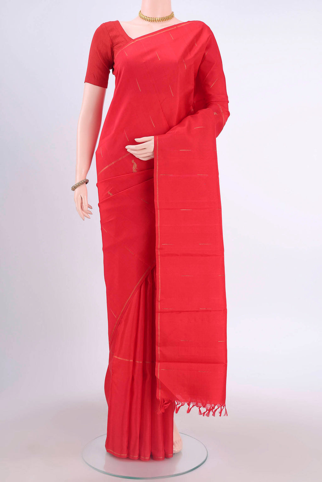 Red Kanchipuram Silk Saree with Zari Butta on the body and Zari Border displayed on a mannequin
