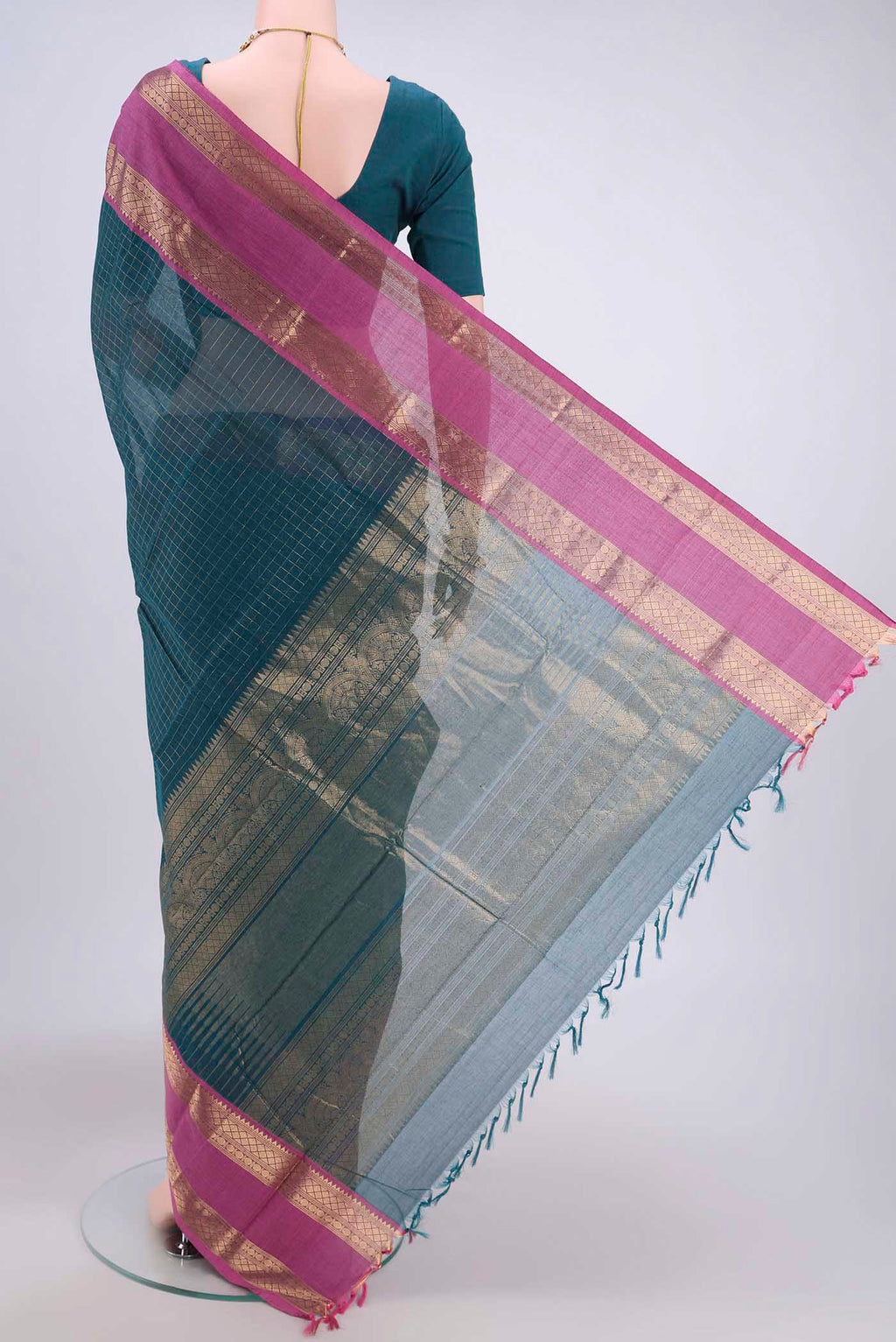 Flat view of Green Kanchi Cotton Saree with Checked design on the body and Zari Border. 