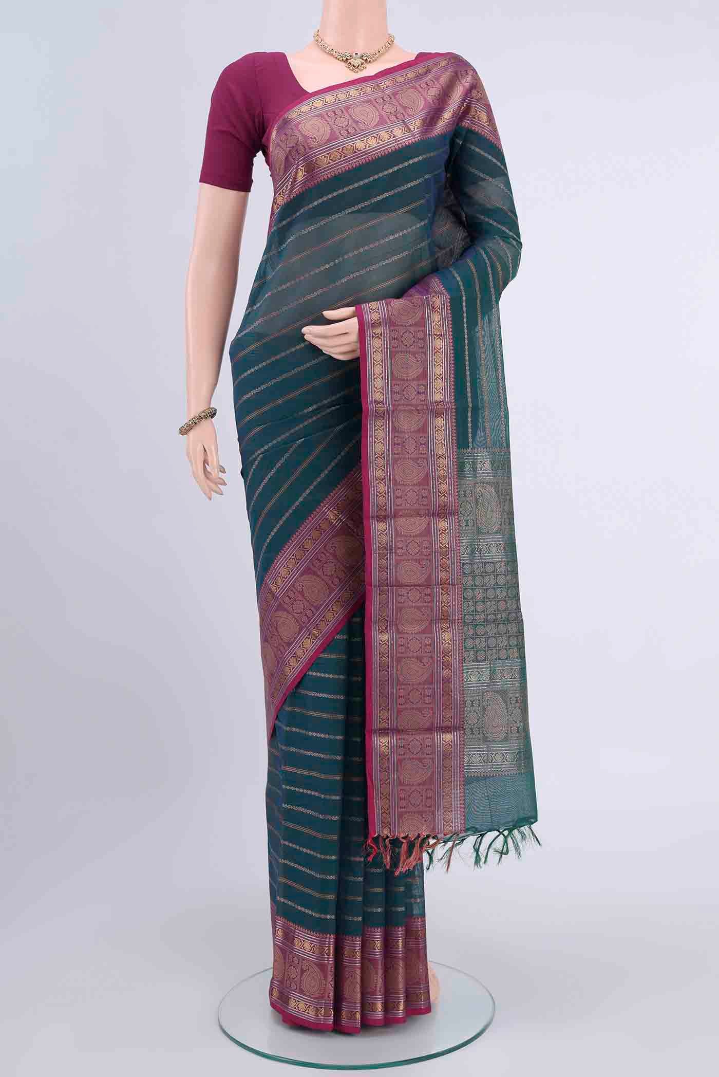 Blue Kanchi Cotton Saree with Stripes on the body and Zari And Thread Border displayed on a mannequin