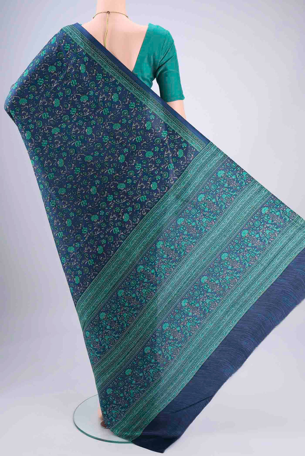 Flat view of Navy Blue Printed Silk Saree with Floral Print on the body and Printed Border. 
