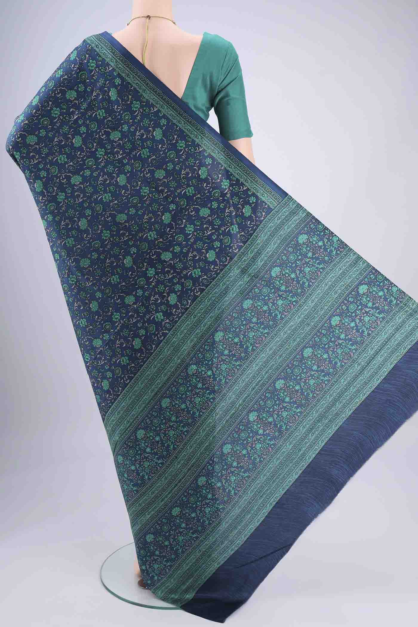 Flat view of Navy Blue Printed Silk Saree with Floral Print on the body and Printed Border. 
