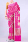 Rani Pink Banarasi Kora Silk Saree with Zari Brocade on the body and Zari Border displayed on a mannequin
