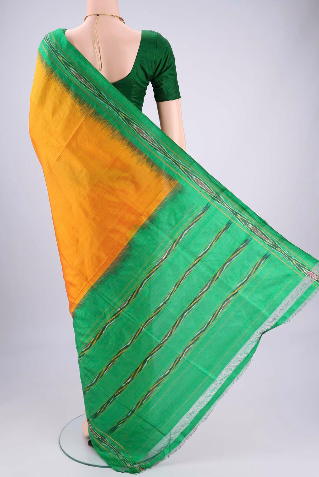 Flat view of Yellow Pochampally Silk Saree with Plain Body and Ikat Border. 