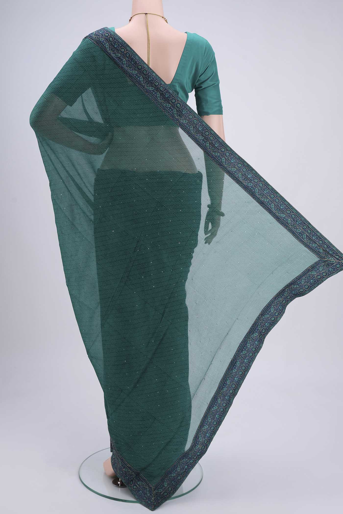 Flat view of Green Mysore Chiffon Saree with Embroidery on the body and Embroidery Border. 